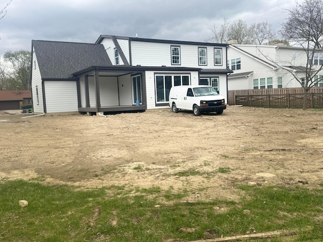 view of front of property featuring fence