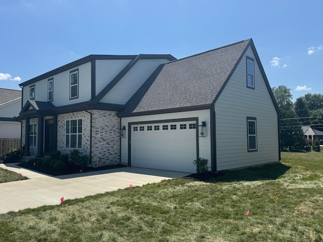 3509 Redding Rd, Upper Arlington, OH 43221 - view of front of house with a garage, driveway, a front yard, a shingled roof, and brick siding
