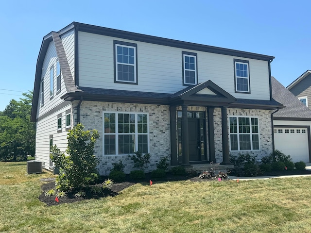 3509 Redding Rd, Upper Arlington, OH 43221 - view of front facade with a front lawn, an attached garage, and brick siding