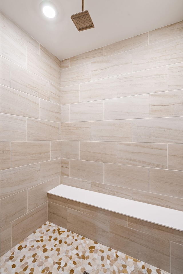 bathroom with tiled shower