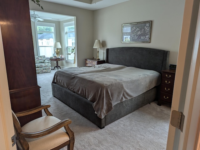 bedroom featuring light carpet