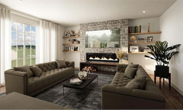 living room featuring baseboards, a stone fireplace, wood finished floors, and recessed lighting