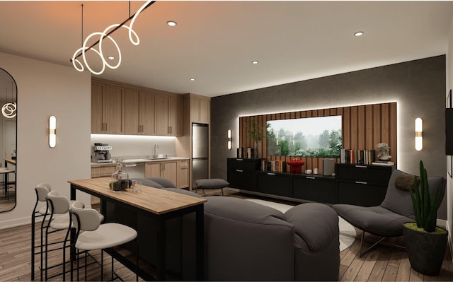 living area with recessed lighting and light wood-type flooring