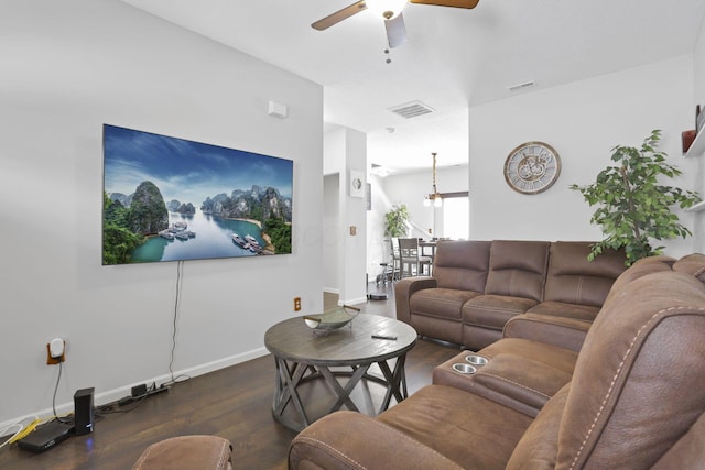 living room with ceiling fan and dark hardwood / wood-style flooring