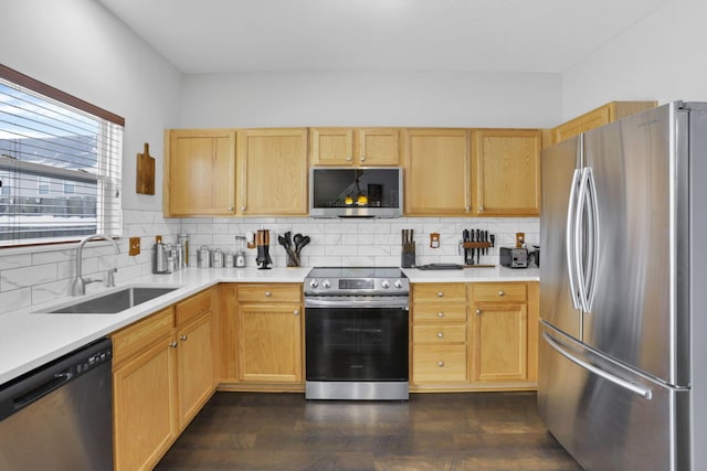 kitchen with light brown cabinets, sink, tasteful backsplash, dark hardwood / wood-style flooring, and stainless steel appliances