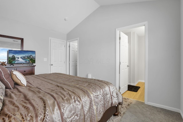 bedroom featuring vaulted ceiling