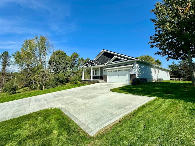 view of front of home with a garage and a front lawn