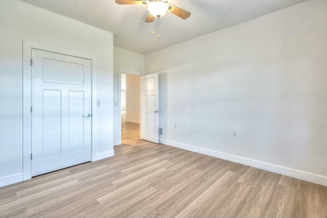 unfurnished bedroom featuring ceiling fan and light wood-type flooring