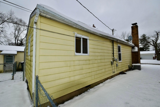 view of snow covered property