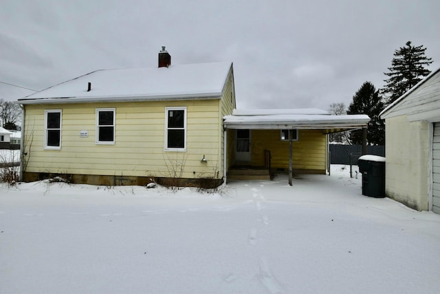 view of snow covered house