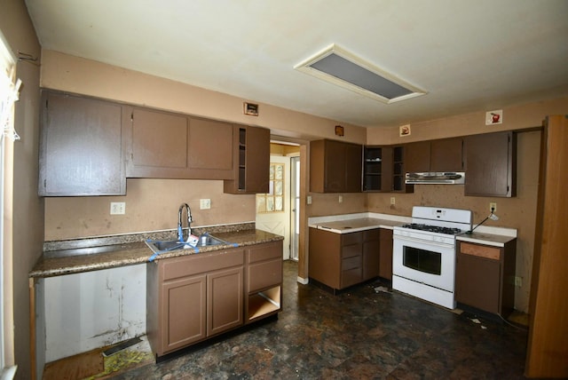 kitchen with ventilation hood, sink, and white range with gas cooktop