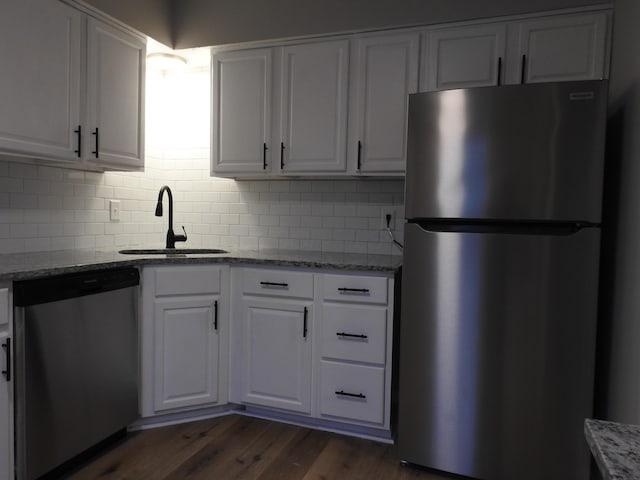 kitchen featuring sink, white cabinets, and stainless steel appliances