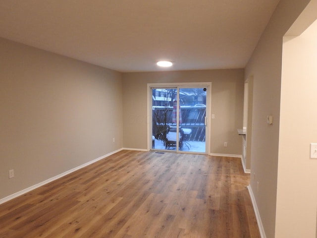 spare room featuring hardwood / wood-style floors