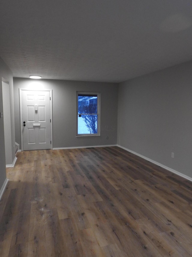 interior space with dark wood-type flooring