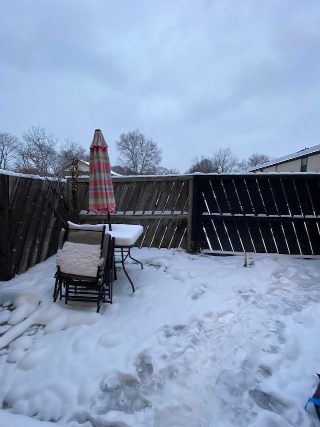 view of yard covered in snow