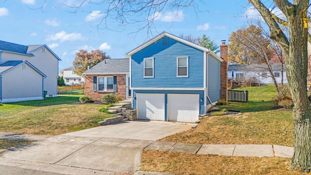 view of front of home with a front yard and a garage