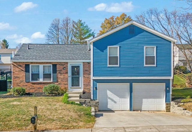 tri-level home with a garage and a front lawn