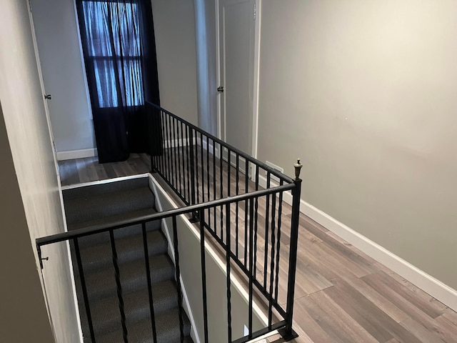 staircase featuring hardwood / wood-style flooring