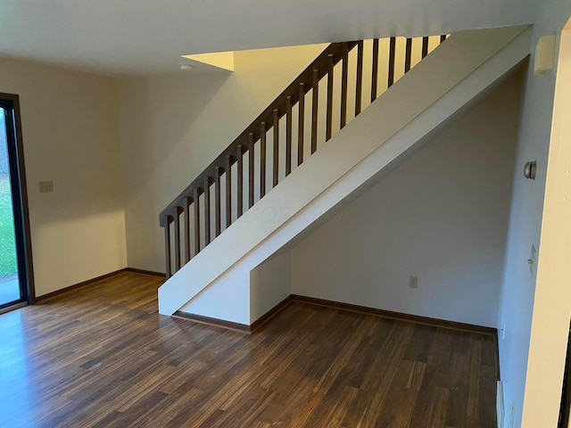 stairs with hardwood / wood-style flooring