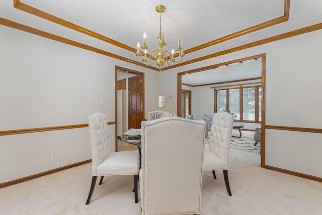 dining area featuring a textured ceiling, light colored carpet, crown molding, and an inviting chandelier