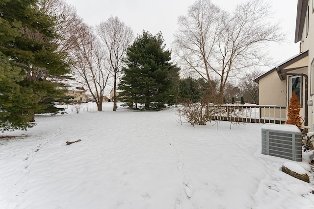 yard layered in snow with cooling unit