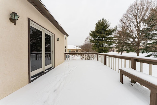 view of snow covered deck