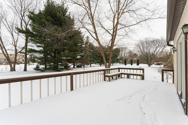 view of snow covered deck