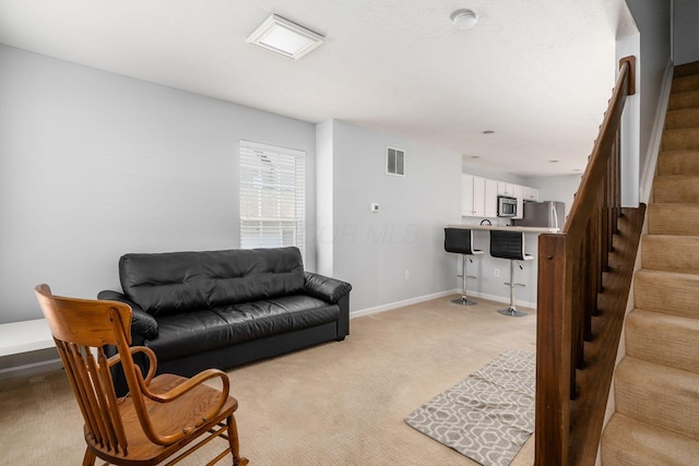 living room with light carpet