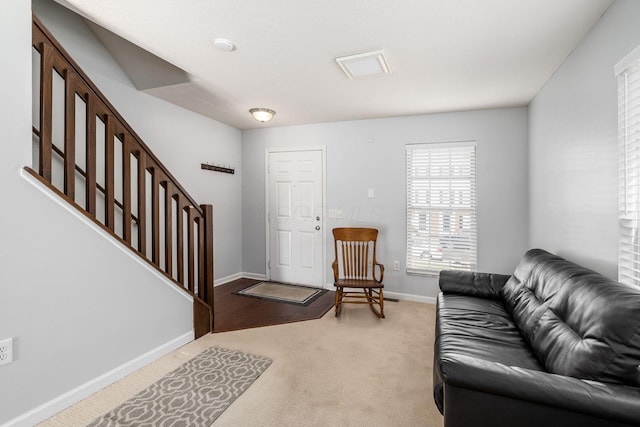 living room featuring light carpet