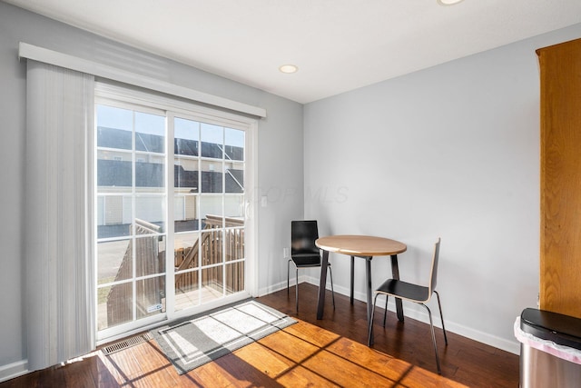 dining area with dark wood-type flooring