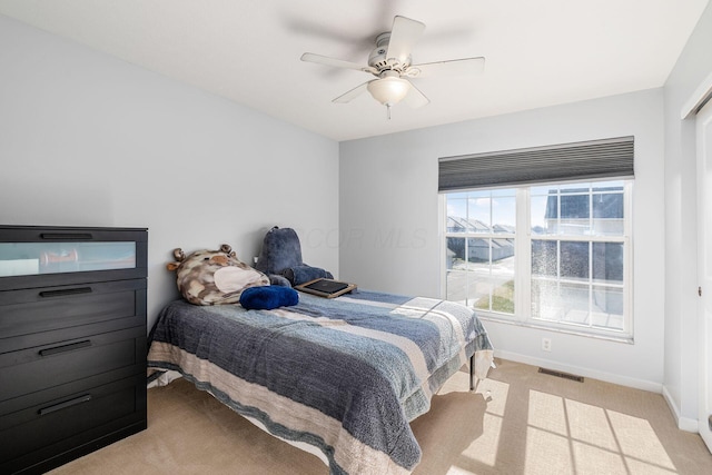 carpeted bedroom with ceiling fan