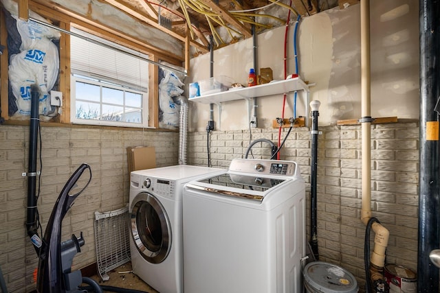 clothes washing area featuring washing machine and dryer