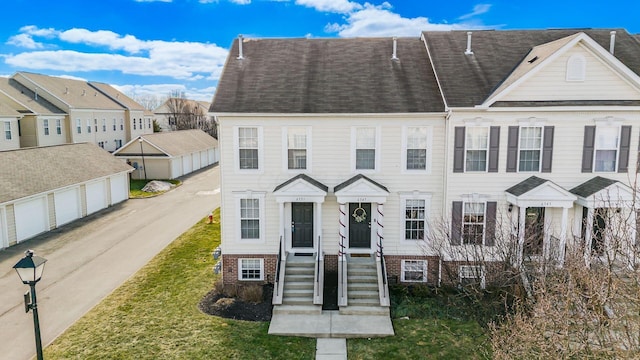 townhome / multi-family property featuring a garage