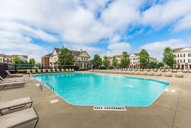 view of swimming pool featuring a patio area