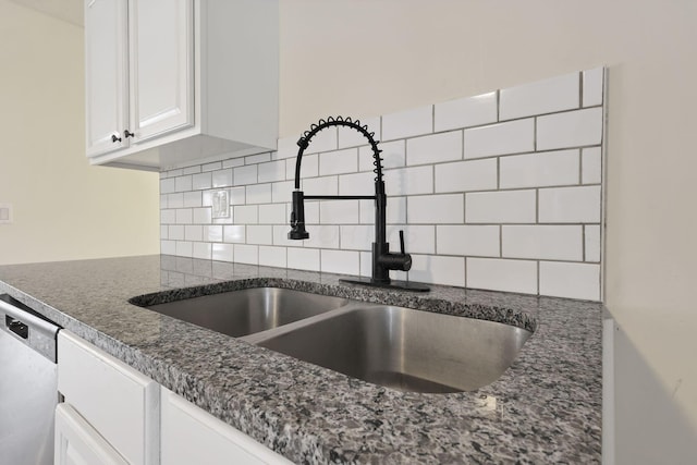 kitchen with white cabinets, dishwasher, backsplash, and sink