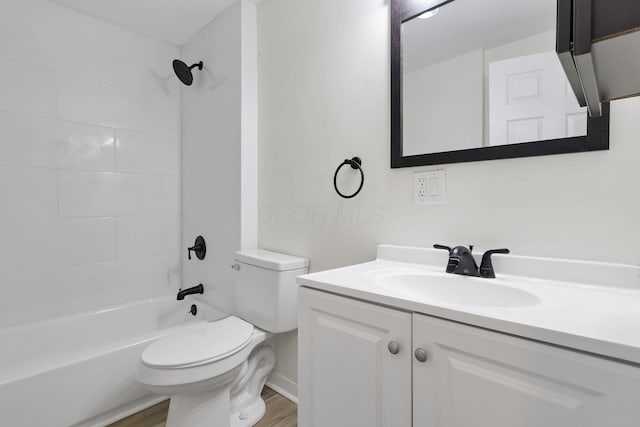 full bathroom with vanity, toilet, wood-type flooring, and bathtub / shower combination