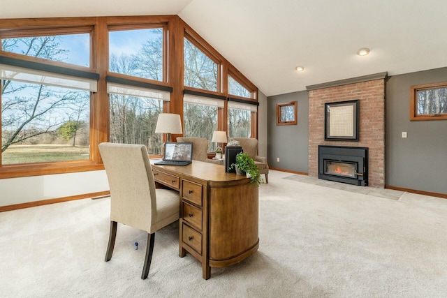 office area with lofted ceiling, light carpet, and a brick fireplace