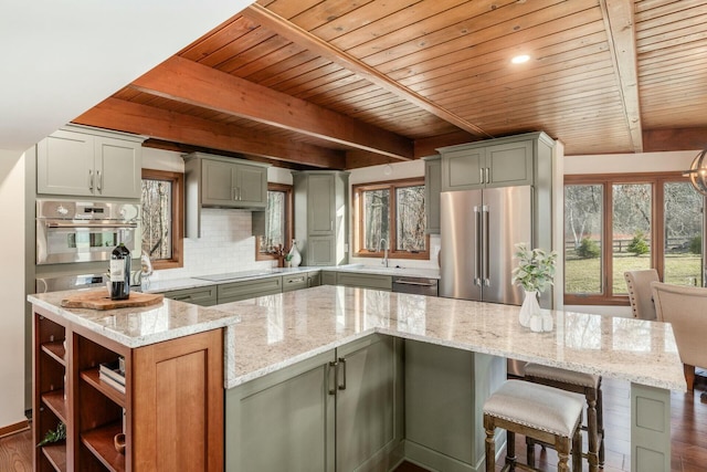 kitchen featuring light stone counters, wooden ceiling, and appliances with stainless steel finishes