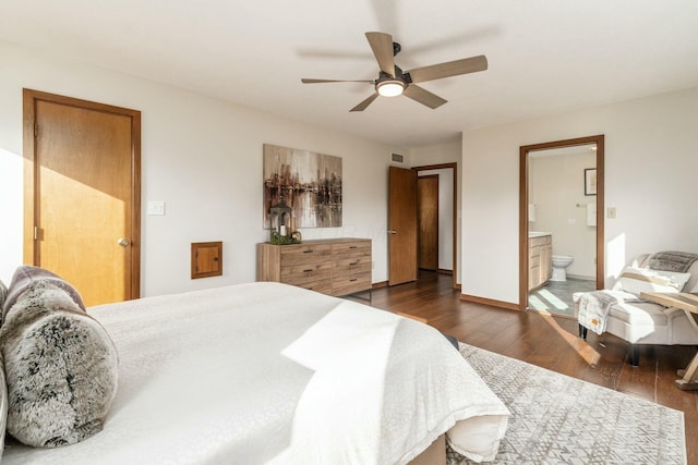 bedroom with connected bathroom, ceiling fan, and dark wood-type flooring