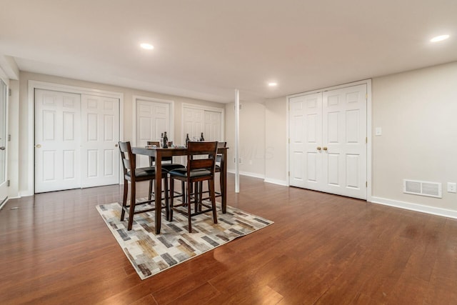 dining area featuring dark hardwood / wood-style floors