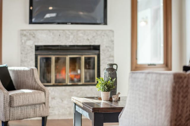 sitting room featuring a high end fireplace