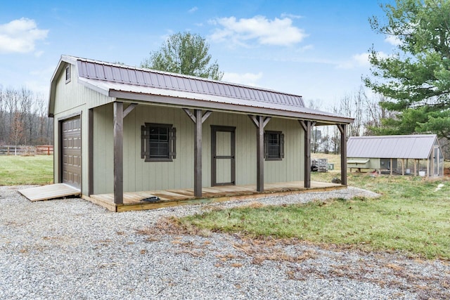 view of front of home featuring an outbuilding