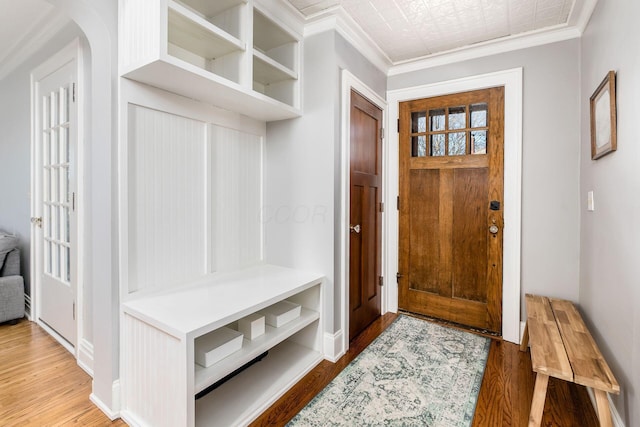 mudroom featuring hardwood / wood-style flooring and crown molding