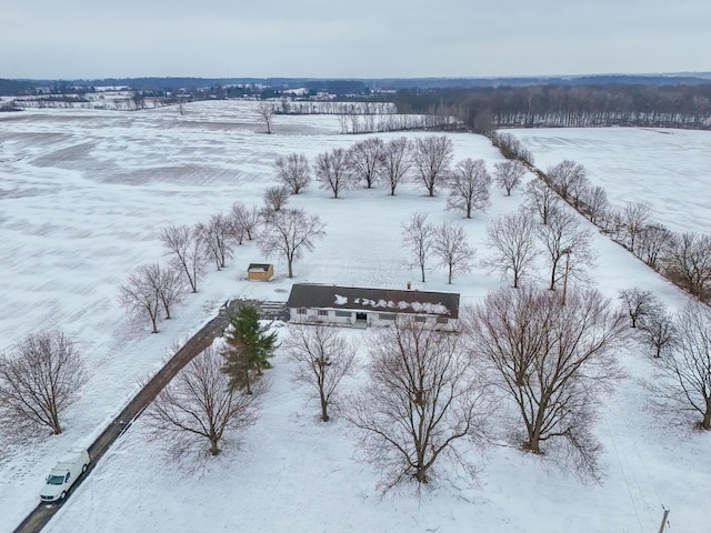 snowy aerial view featuring a rural view