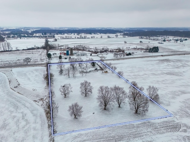 snowy aerial view with a rural view