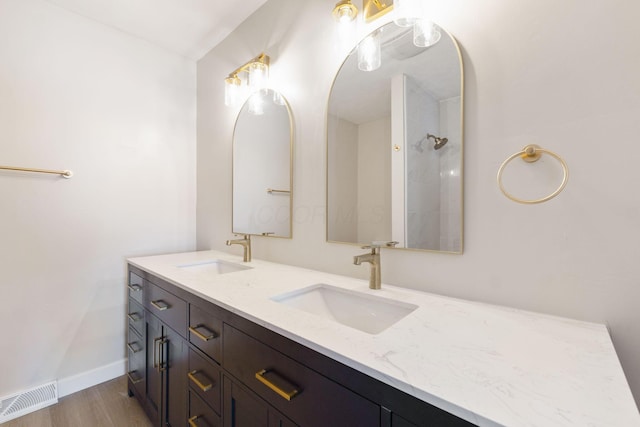 bathroom with hardwood / wood-style floors and vanity