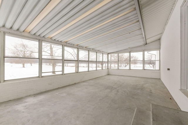 unfurnished sunroom with vaulted ceiling