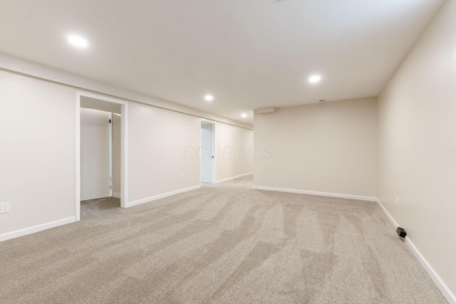 basement with light colored carpet