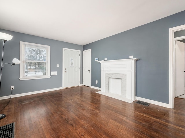 unfurnished living room with hardwood / wood-style flooring