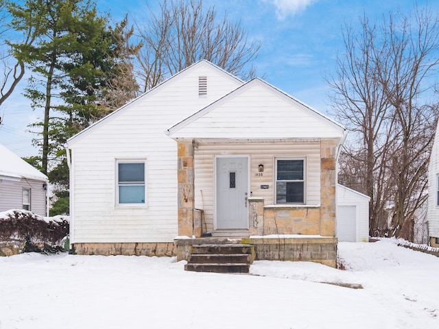 view of front of home featuring an outbuilding and a garage